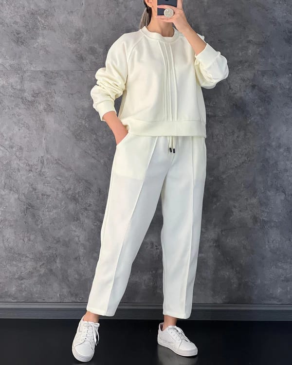 "Women's co-ord set featuring a stylish sweatshirt and matching trousers for a coordinated, comfortable look."