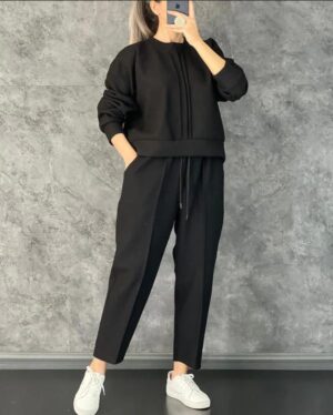 "Women's co-ord set featuring a stylish sweatshirt and matching trousers for a coordinated, comfortable look."