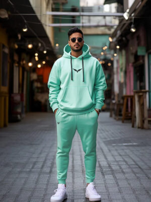 A green two-piece winter outfit with a hoodie and sweatpants.